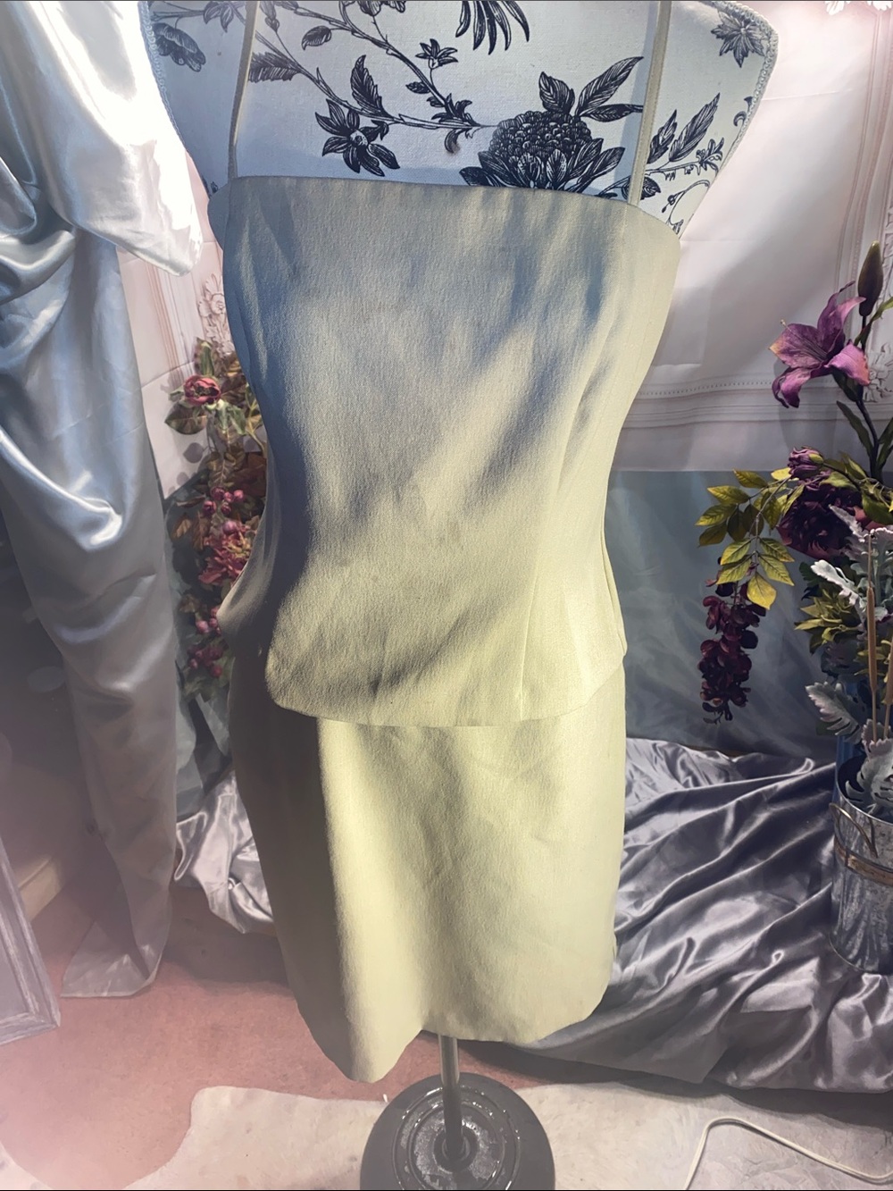 Light tan Strapless Mini skirt and spaghetti strap top.